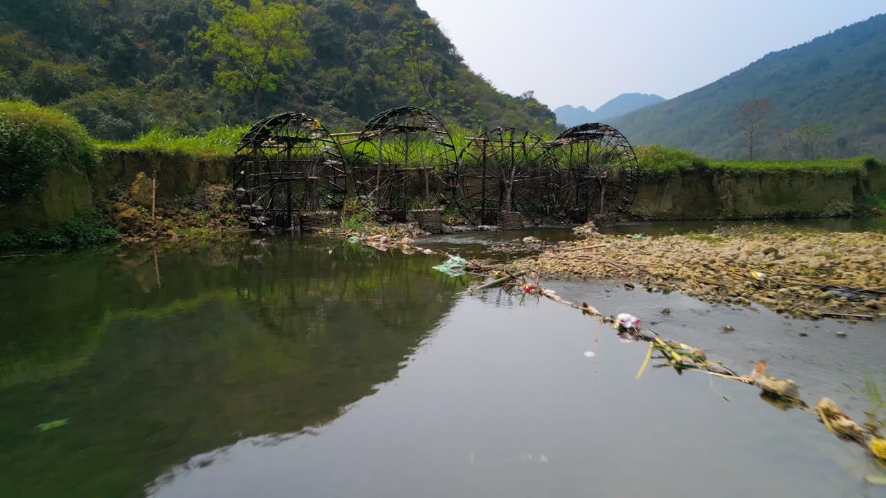 Flying Towards Waterwheels On The Cham River At Pu Luong Nature Reserve In Northern Vietnam. Aerial Drone Shot