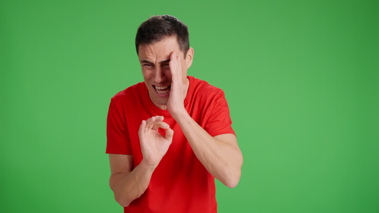 Man playing a joke on someone, on green screen background