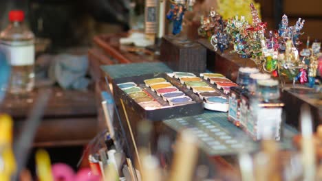 artisan's workshop with miniature figures and paint palette