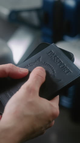 person holding a passport and smartphone