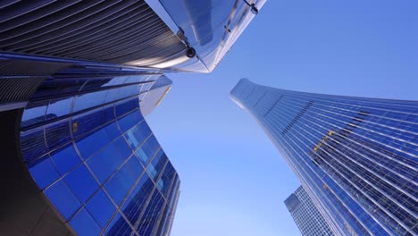 looking up at the high-rise buildings in the city