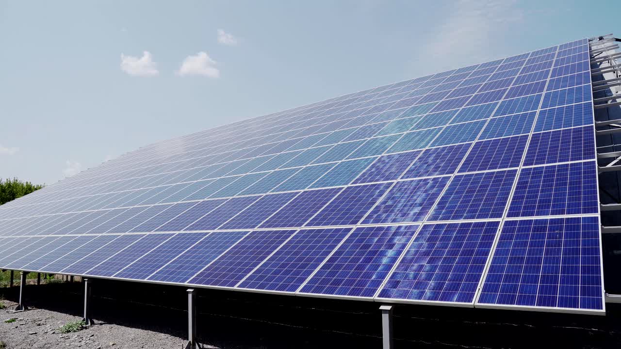Blue solar photovoltaic panels on the roof of a house to produce electricity. Efficient, uninterrupted operation of systems at the power plant