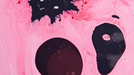 abstract fluid art with pink, black, and red