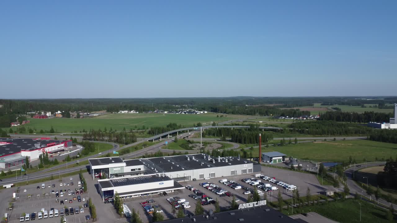 Flyover car dealership in Lahti Finland by highway traffic interchange