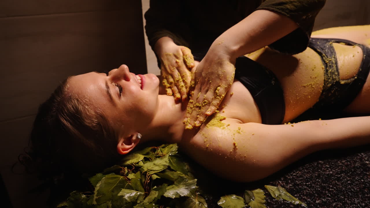 Woman receiving a traditional body treatment