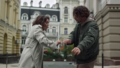 happy couple having fun outdoor. man and woman spending time together on street.