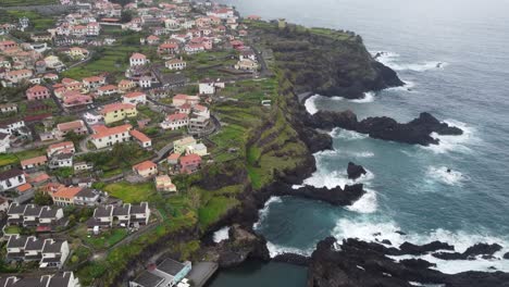 cliff side with the sea and houses in madeira