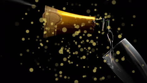 animation of golden dots over champagne pouring into glass