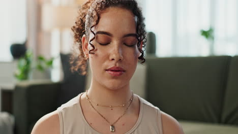 woman meditating with eyes closed
