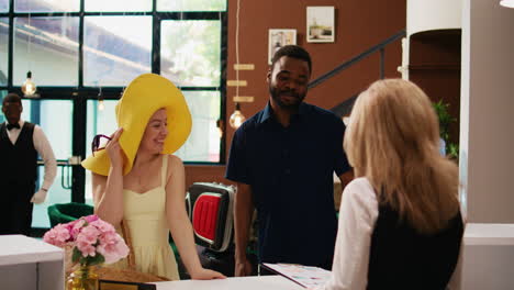 hotel employee greeting guests