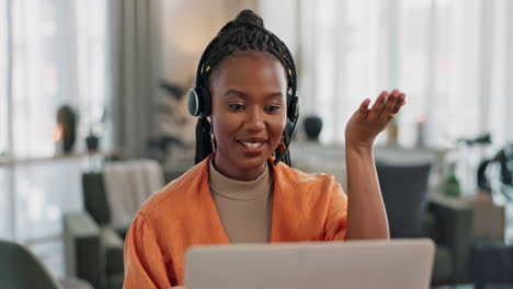 black woman, webinar in home office with laptop