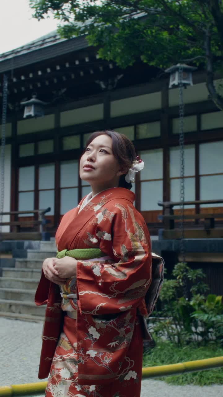 Woman in Traditional Japanese Kimono in a Garden Setting