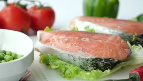 preparing salmon with vegetables