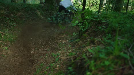 A-mountain-biker-drifts-down-a-steep-trail