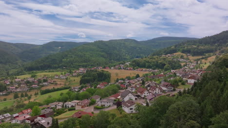 aerial footage of german village and forested landscape