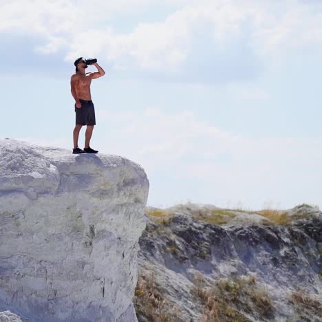 man standing on top of mountain