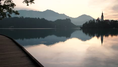 a beautiful reflection of lake bled at sunrise