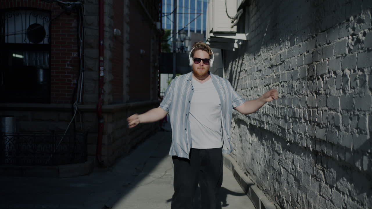 Man Dancing in a City Alley