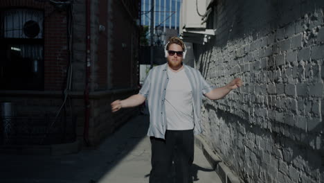 man dancing in a city alley