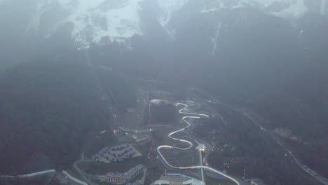 aerial view of a bobsleigh track in the mountains