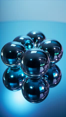 reflective blue spheres on a mirrored surface