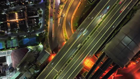 aerial night view of city highway with heavy traffic