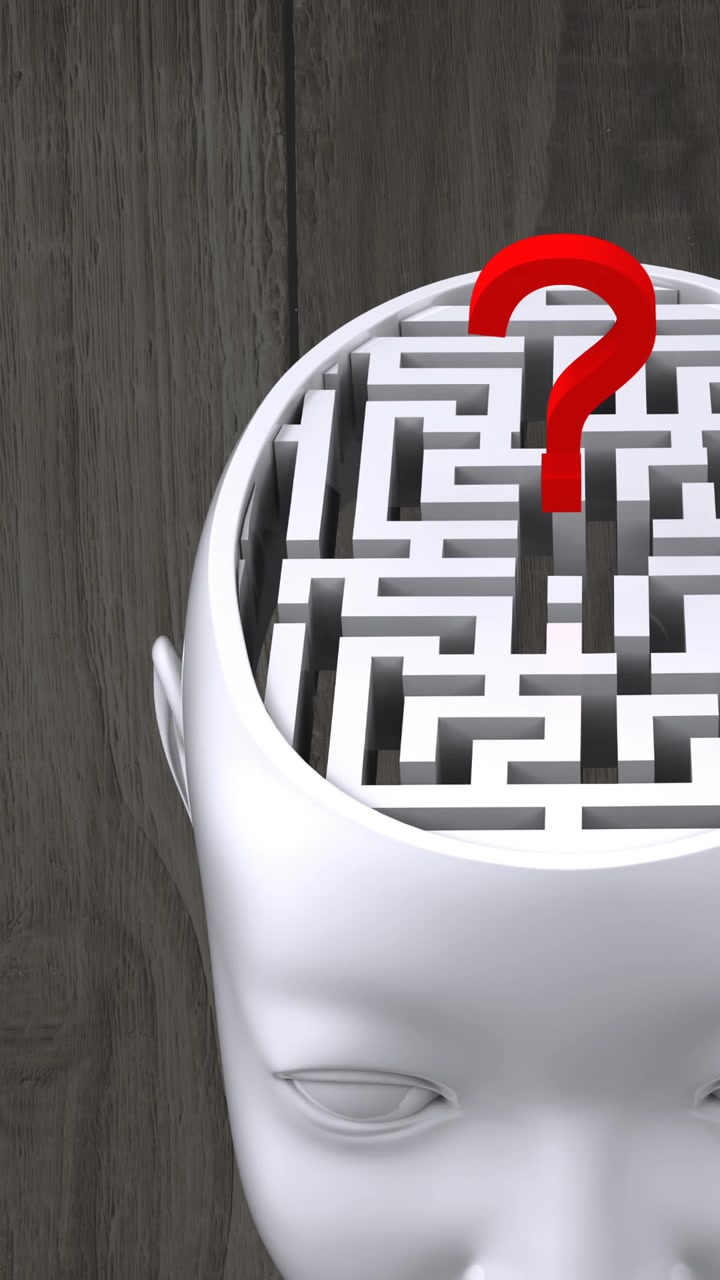 Animazione di pezzi di puzzle verdi, gialli e rossi che cadono su modello di testa umana con labirinto