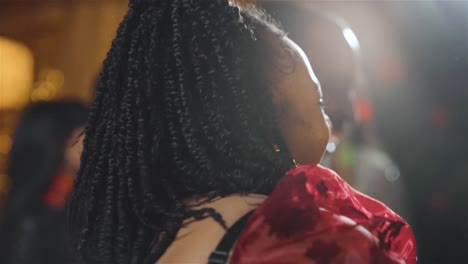 close up shot of a group of friends dancing in a bar