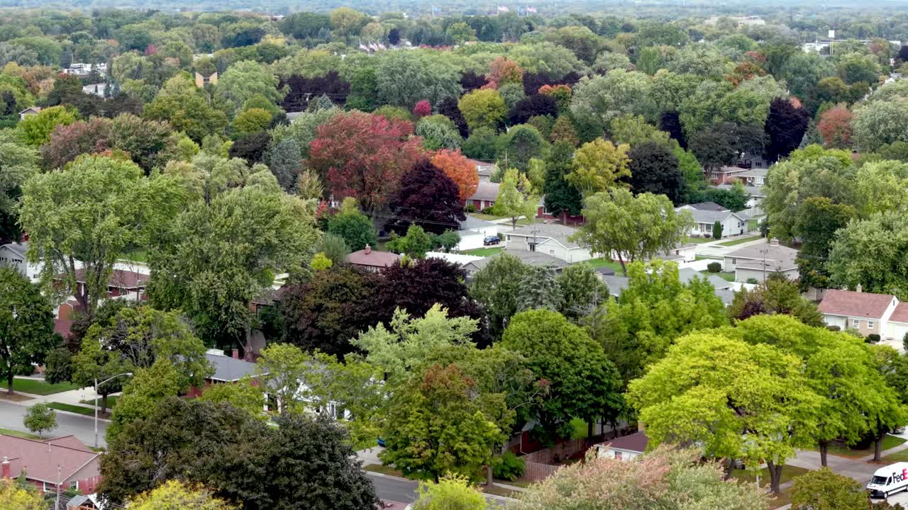 aerial at treetop level of homes and neighborhoods in green bay wisconsin
