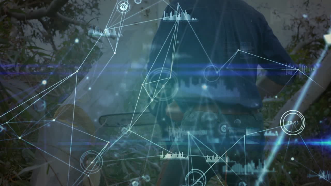 Man wearing blue shirt surveying forest edge, showing technology network overlay with data charts