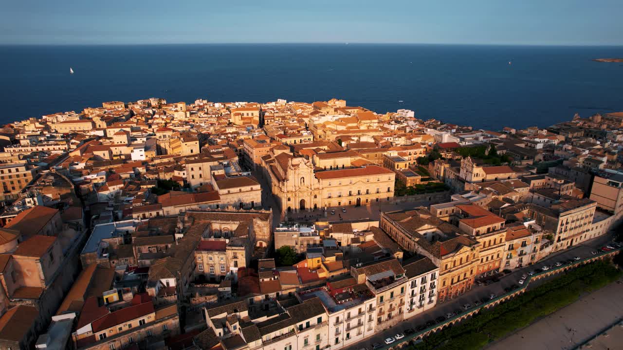 Ortigia from above, showing old historic buildings, Castello Maniace and harbor. Cinematic aerial, Syracuse Sicily