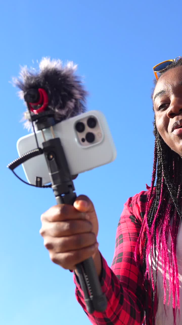 Woman Vlogging with Smartphone and Microphone