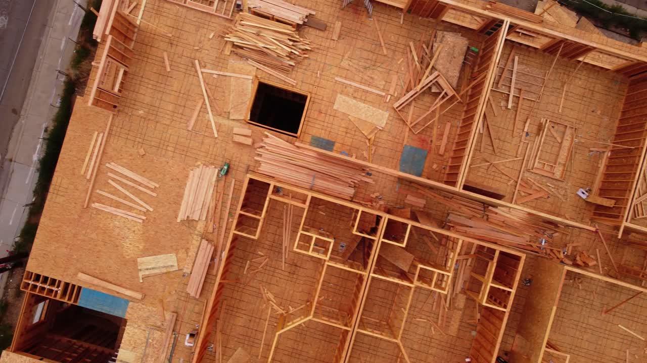 Wood framed construction site left abandoned as work stopped due to pandemic supply chain shutdown