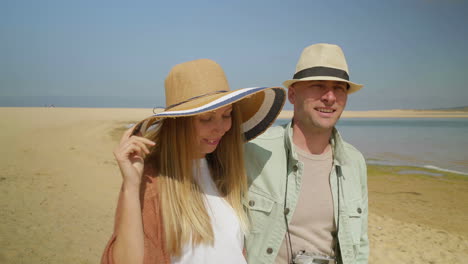 Couple-with-camera-walking-together-outdoor