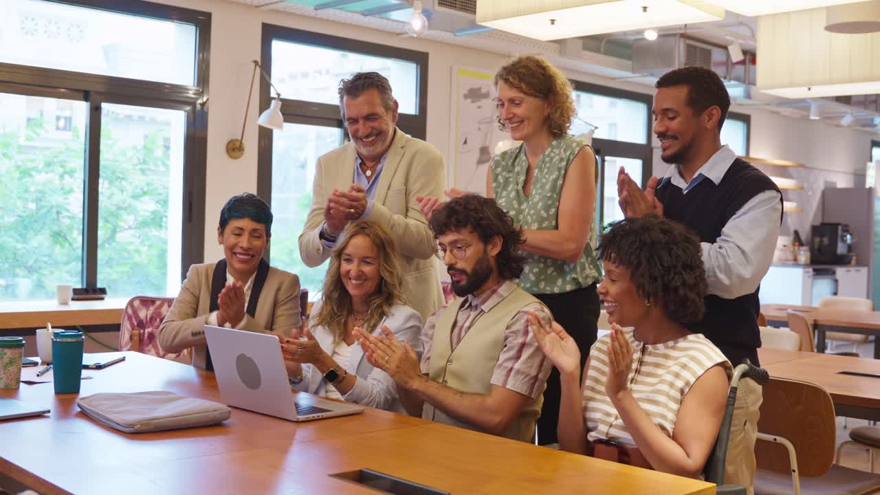 Group of business people celebrating success in the office
