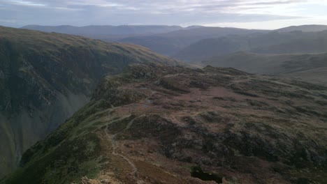 Mountains-and-hazy-fells-up-to-the-horizon-at-dawn-in-autumn