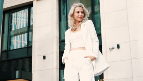 stylish woman in white business suit