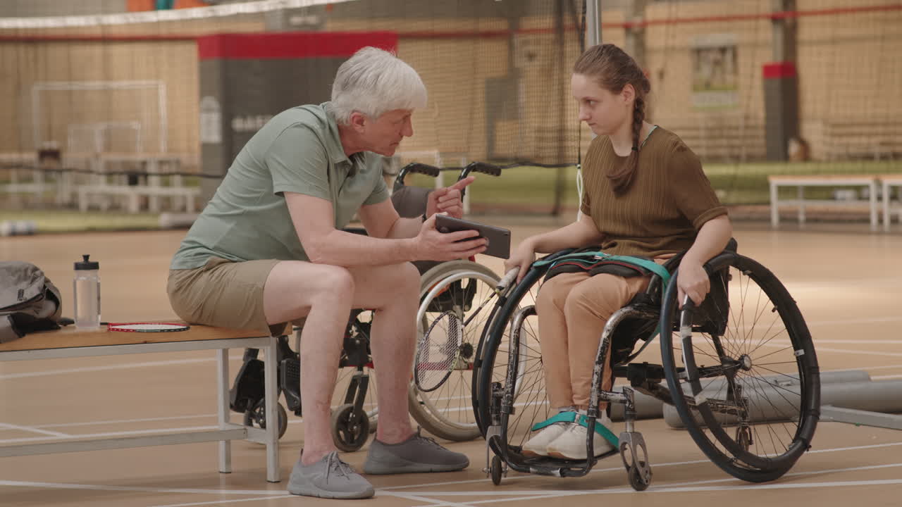 Coach Instructing Girl Before Match