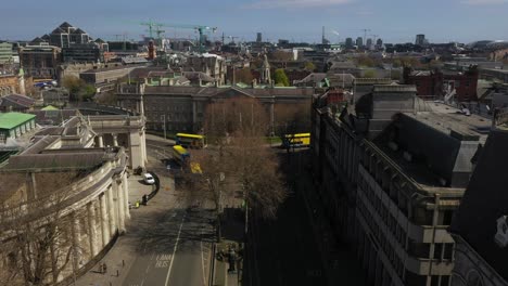 Trinity-College,-College-Green,-Dublin,-Lockdown,-April-2020,-Ireland,-Drone-gradually-lifts-upwards-revealing-facade-of-the-building