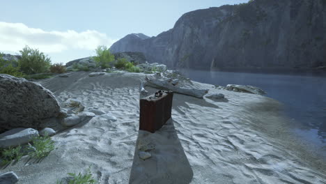 a briefcase on a beach with mountains in the background