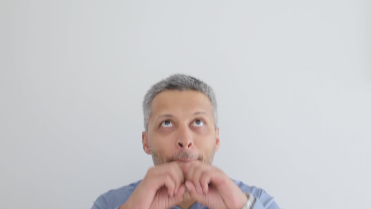 Man Making Funny and Expressive Faces with Hand Gestures