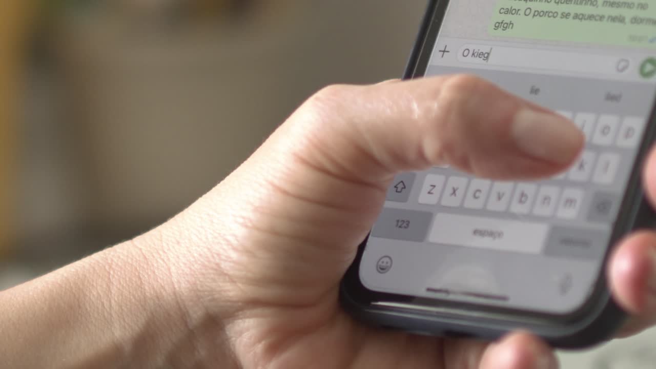 White female reading and responding to text message on mobile device