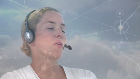 Animation-of-network-of-connections-with-globe-over-businesswoman-using-phone-headset