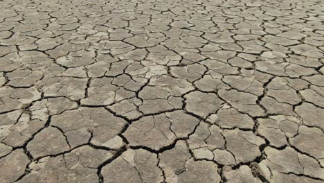 Moving-forward-over-cracked-soil-in-Australian-Casuarina-island-due-to-climate-change-and-drought,-increased-temperatures,-global-warming