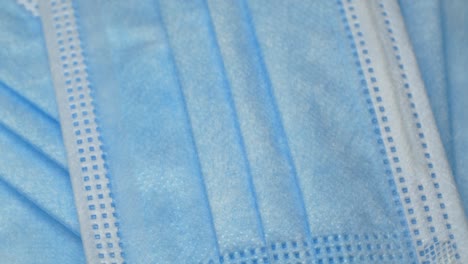 close-up medical disposable blue protective mask texture, coronavirus covid-19