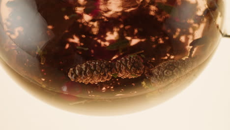 close up of a glass teapot with a winter-themed herbal tea