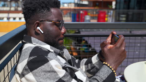 man using smartphone outdoors