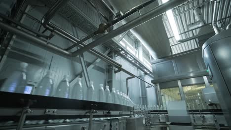 conveyor belt with bottles of drinking water at a modern beverage plant