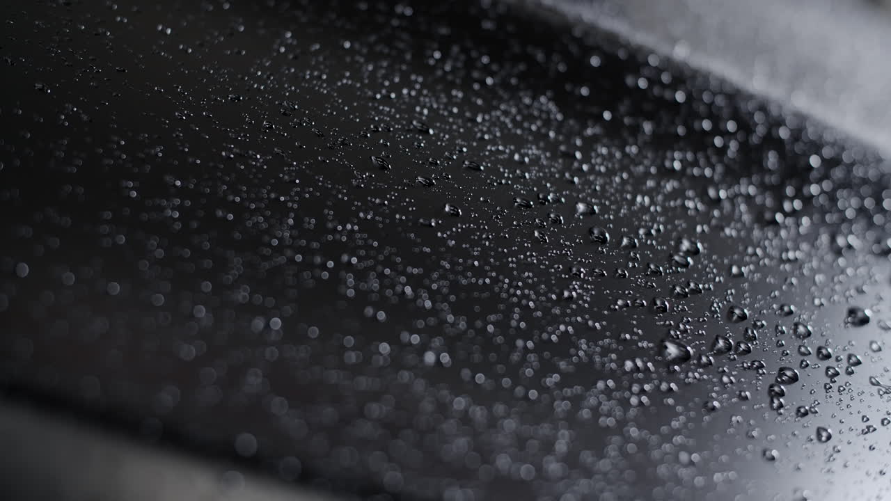 Water Drops on a Black Car Hood