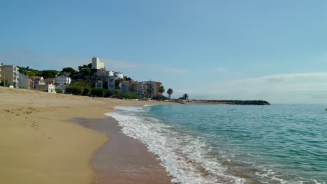 Platja-de-les-Barques-sea-field-Maresme-Barcelona-Mediterranean-coast-plane-close-to-turquoise-blue-transparent-water-beach-without-people